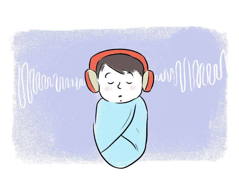 Baby listening to music on earphones